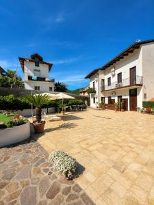 a courtyard of a building with a patio at Carlo's Luxury Villa in Agerola
