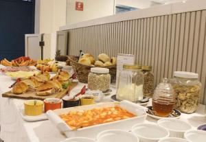 a table with many different types of food on it at Landscape Beira Mar - Lindo, Luxo, Frente mar in Fortaleza +106 photos