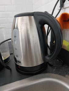 a black and silver tea kettle on a counter at Cozy 5 in Belgrade +9 photos