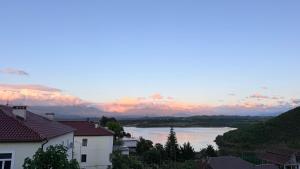 a view of a body of water with buildings at Ulëz Nature Apartment in Ulëz