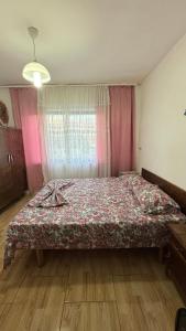 a bedroom with a large bed in a room at Ulëz Nature Apartment in Ulëz
