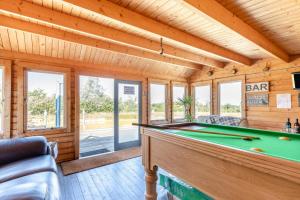 a room with a pool table in a house at 1 Bed in Beaworthy oc-93267 in Ashwater