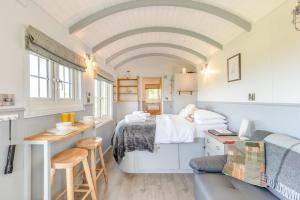 a small room with a bed and a desk in a room at 1 Bed in Beaworthy oc-93267 in Ashwater