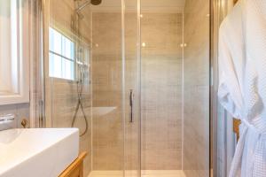 a bathroom with a shower and a sink at 1 Bed in Beaworthy oc-93267 in Ashwater +29 photos