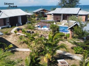 an aerial view of a resort with a swimming pool at Sekepeng Penarek in Kampung Penarik