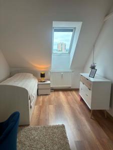 a small bedroom with a bed and a window at Apartmán Urban Kubín in Dolný Kubín