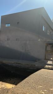a building with smoke coming out of the side of it at Center in Uberlândia