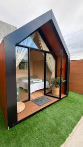 a small house with a bed in a room at Hotel Terra do Sal in Mossoró