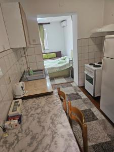 a kitchen with a counter top and a stove top oven at New apartment Old town 2 in Sarajevo