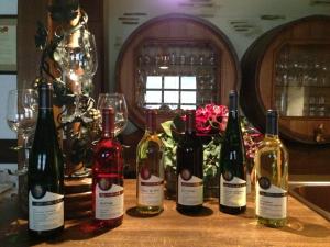 a group of wine bottles sitting on a table at Ferienweingut Haus Christa in Briedern