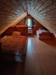 a bedroom with two beds in a attic at Hytte Lødingen Vestbygd, når Lofoten, med utsikt in Lødingen