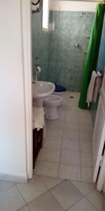 a bathroom with a toilet and a sink and a shower at Il fortino affittacamere in Porto Santo Stefano