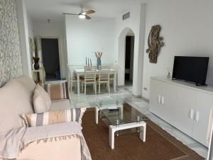 a living room with a couch and a table at Gilarez in Estepona