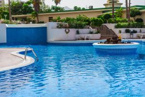 a swimming pool in a resort with a swimming pool at Paraiso Terrace Suite in Playa Paraiso