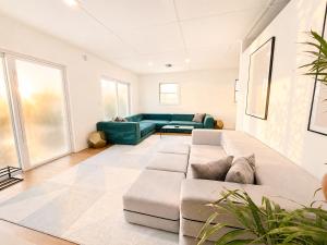 a large living room with a couch at Tropical Luxe Villa-Near Airport, Minutes to Lido key beach, Downtown and Dining in Sarasota