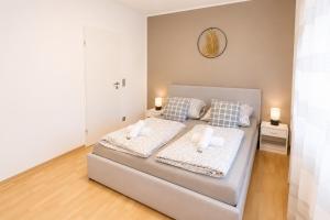 a bedroom with a bed with two candles on it at Gartenparadies mit Rheinblick in Urbar in Urbar