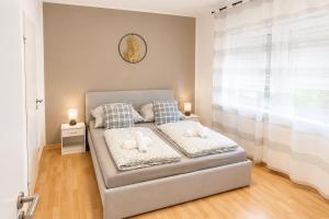 a bedroom with a bed with two pillows at Gartenparadies mit Rheinblick in Urbar in Urbar