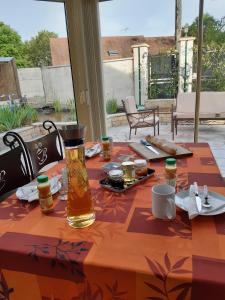 a table with a table cloth with food on it at Au Bon Vivant in Dampierre-sur-Salon +8 photos