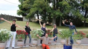 a group of people standing inront of potted plants at Au Bon Vivant in Dampierre-sur-Salon