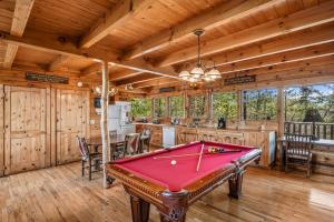 a pool table in a room with a kitchen at Fox Ridge #37 by Venture Smoky Mountains in Sevierville