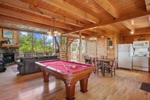 a living room with a pool table in it at Fox Ridge #37 by Venture Smoky Mountains in Sevierville