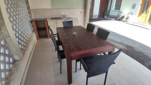 a wooden table and chairs in a room at Frane House in Knežak