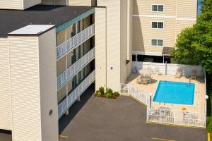 an aerial view of a building with a swimming pool at Boardwalk One in Ocean City +1 photo
