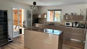 a kitchen with a large island in the middle at Maison Thierry in Pierre Penot