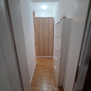 a hallway with a closet and a door at Garden lux 1 in Belgrade