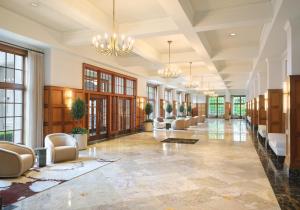 a lobby with couches and chairs in a building at Royal Park Hotel in Rochester