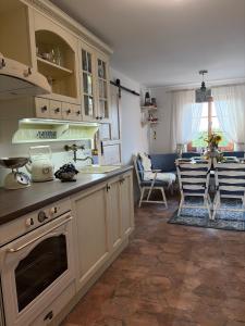 a kitchen with a sink and a stove top oven at Kokodáák in Troskotovice