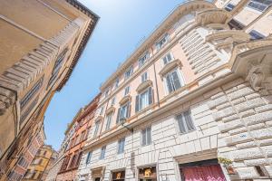 a large building in a city with a blue sky at MInerva Pantheon Suites in Rome