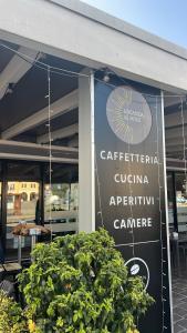 a sign on the side of a building at Locanda Al Sole in Vo Euganeo