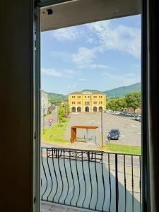 a window with a view of a parking lot at Locanda Al Sole in Vo Euganeo