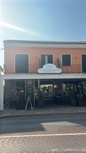 a building with a sign on the front of it at Locanda Al Sole in Vo Euganeo