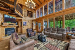 a living room filled with furniture and a fireplace at Mountain Magic #73 by Venture Smoky Mountains in Sevierville