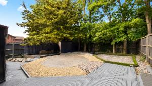 a garden with a circle in the middle at Spacious 5-Bed Entire Home in Sherborne Saint John