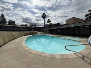 a large swimming pool in the middle of a building at Red Roof Inn Redding in Redding