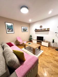 a living room with a couch and a table at Vista Azul Apartment in Ohrid