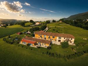 an aerial view of a house on a green field at Apartamentos Rurales Sobremazas in Sobremazas
