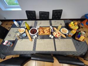 a table with food on top of a table at Domaine Sylvaria in Lassay-sur-Croisne