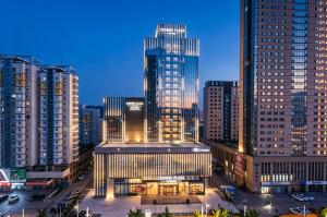 a view of a city with tall buildings at Crowne Plaza Dalian Kerren in Dalian