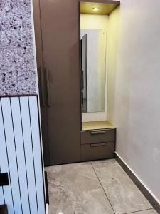 a bathroom with a cabinet and a mirror at South Elegance in Tellicherry +45 photos