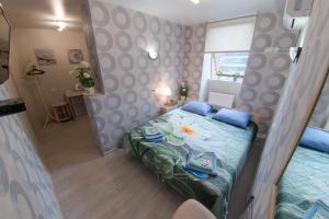 Ένα ή περισσότερα κρεβάτια σε δωμάτιο στο Guest House Ksenia