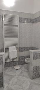 a bathroom with a white toilet and a sink at Magnolia Rooms - Val Di Chy in Val di Chy