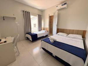Cama ou camas em um quarto em Sky Hotel Ltda