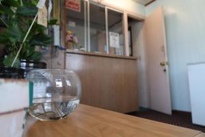 a wine glass sitting on top of a table at Starlite Motel in Heath