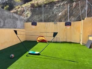 a batting cage with a frisbee and a goal at Casa Serrano in Abrucena