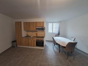 a kitchen and dining room with a table and chairs at T2 Concoules - Panorama, Randonnées, Etapes motards in Concoules