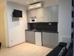 Kuchyň nebo kuchyňský kout v ubytování Apartahotel Baldiri
